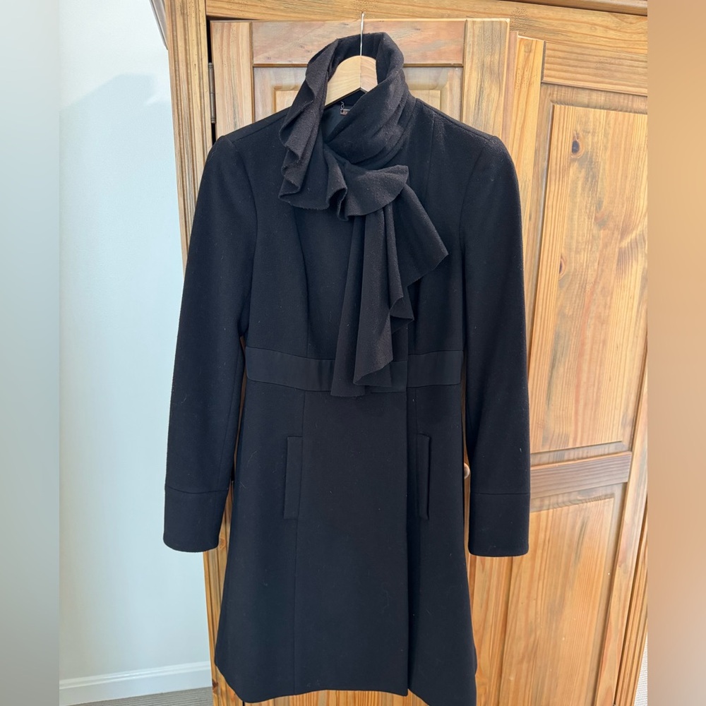 DVF black dress mid length coat. Slight rip in the pocket, picture shows rip.